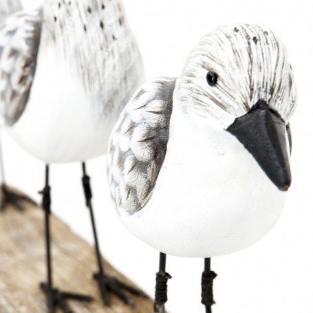 Tres pájaros marineros sobre base